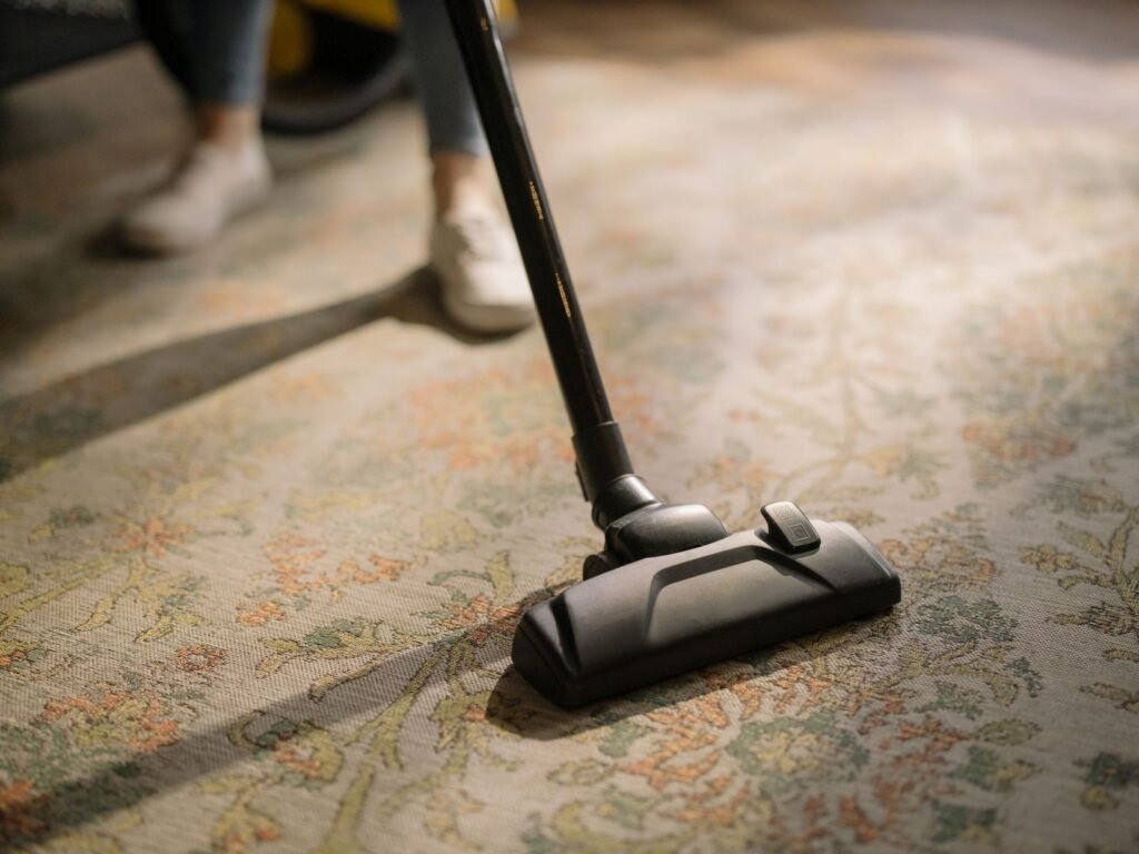 A cleaning machine head drawn across a patterned carpet