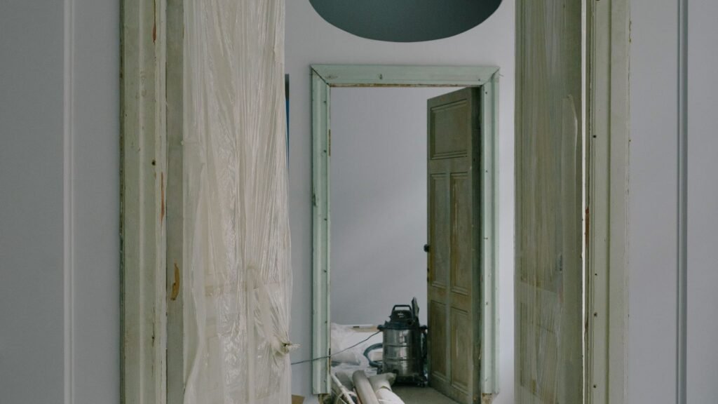 Room during renovation with dust sheets