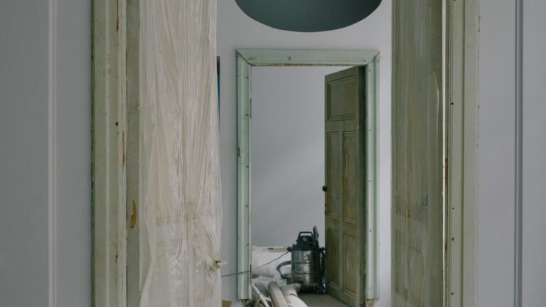 Room during renovation with dust sheets