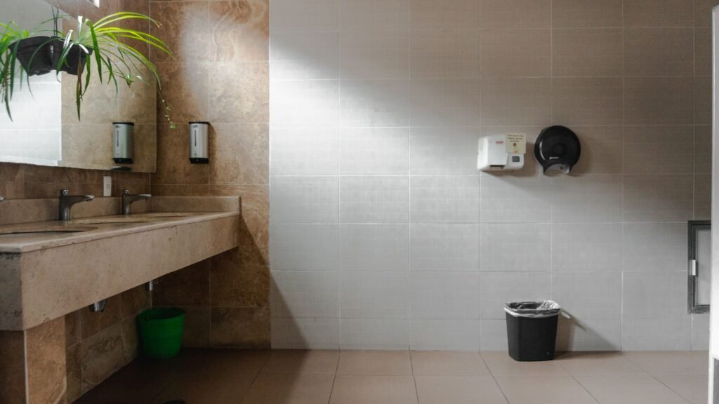 Clean commercial washroom with basins and soap dispensers in a Manchester workplace